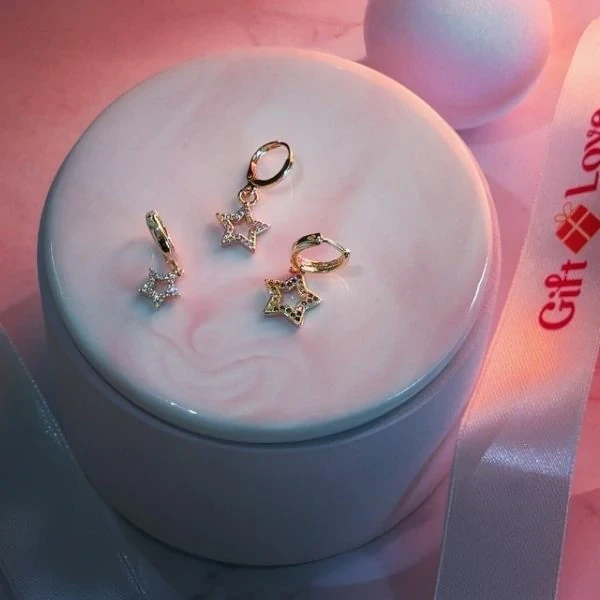 Three Small Yellow Gold Earrings with Dangling Star Charms